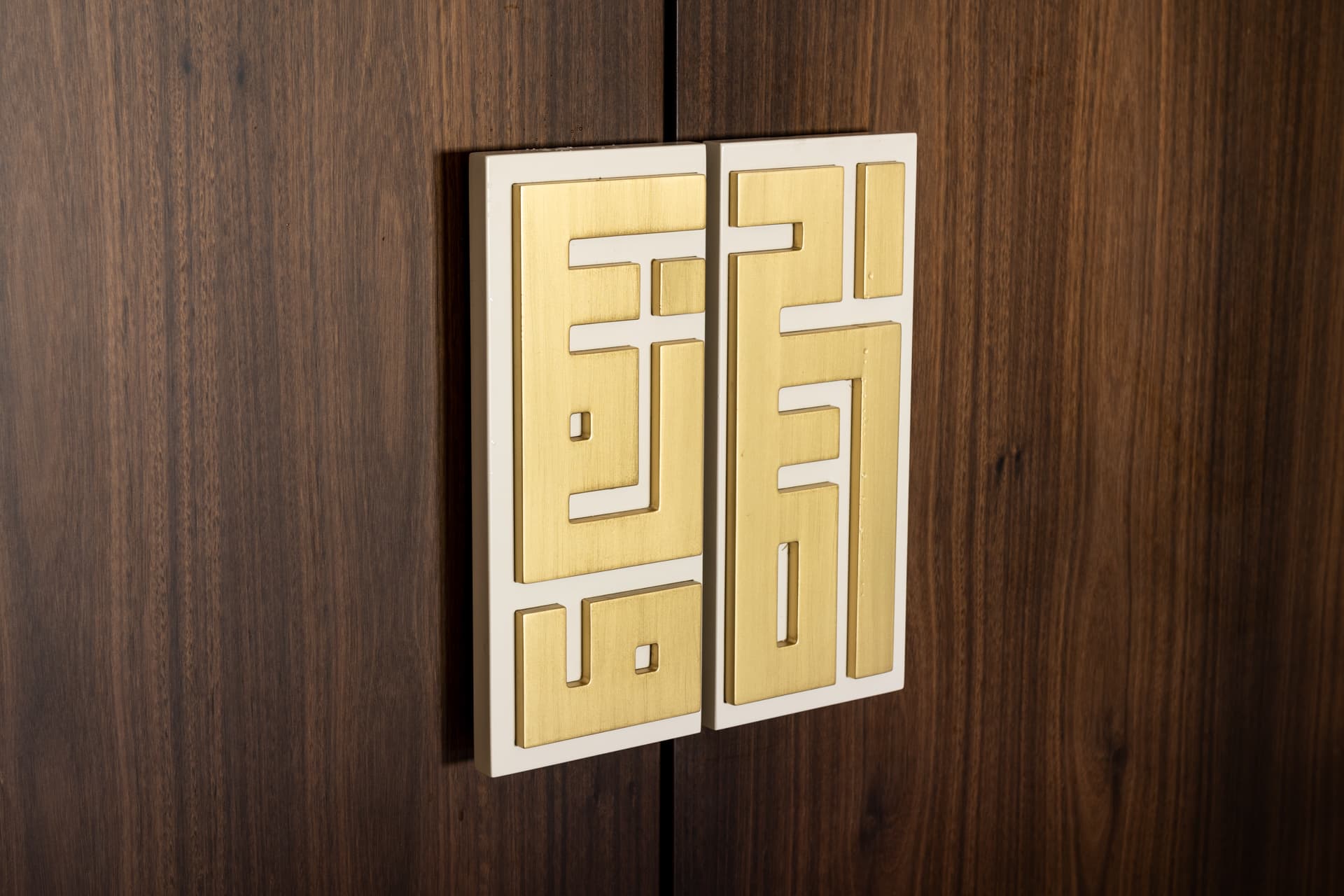 Black-framed glass display cabinet with stacked china