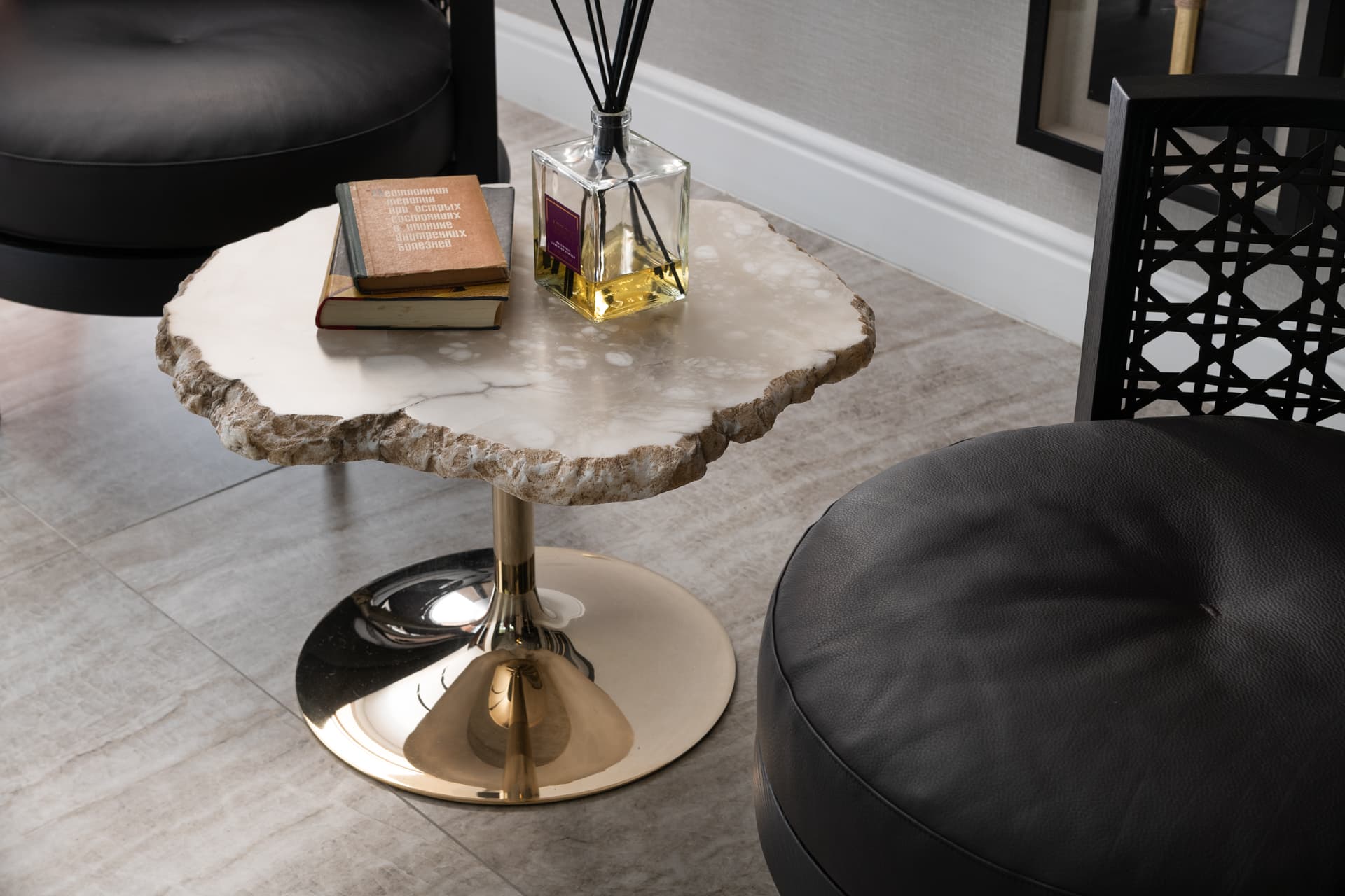 Gallery wall arrangement with framed art on cream plaster