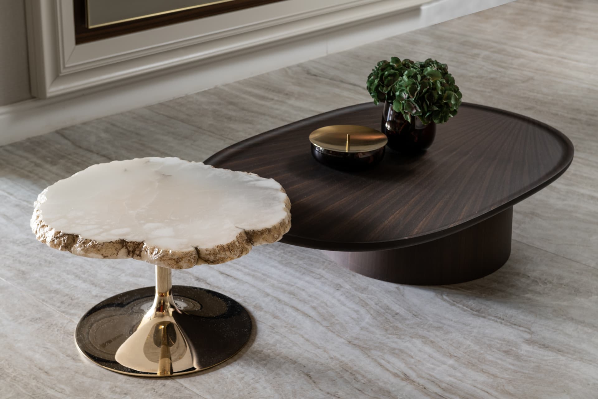 Walnut TV niche with charcoal armchair and disc ceiling light