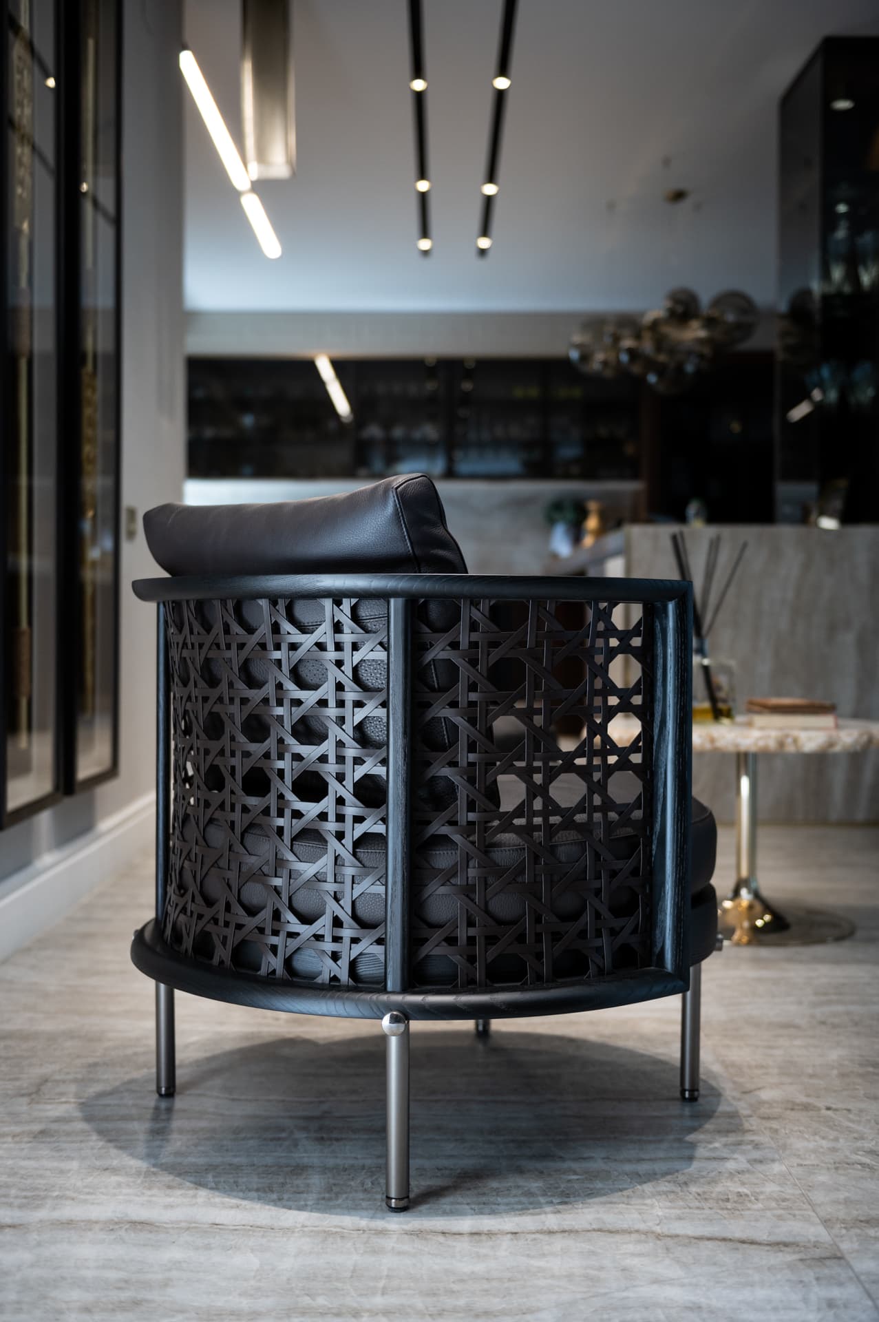 White marble countertop against dark walnut lower cabinetry