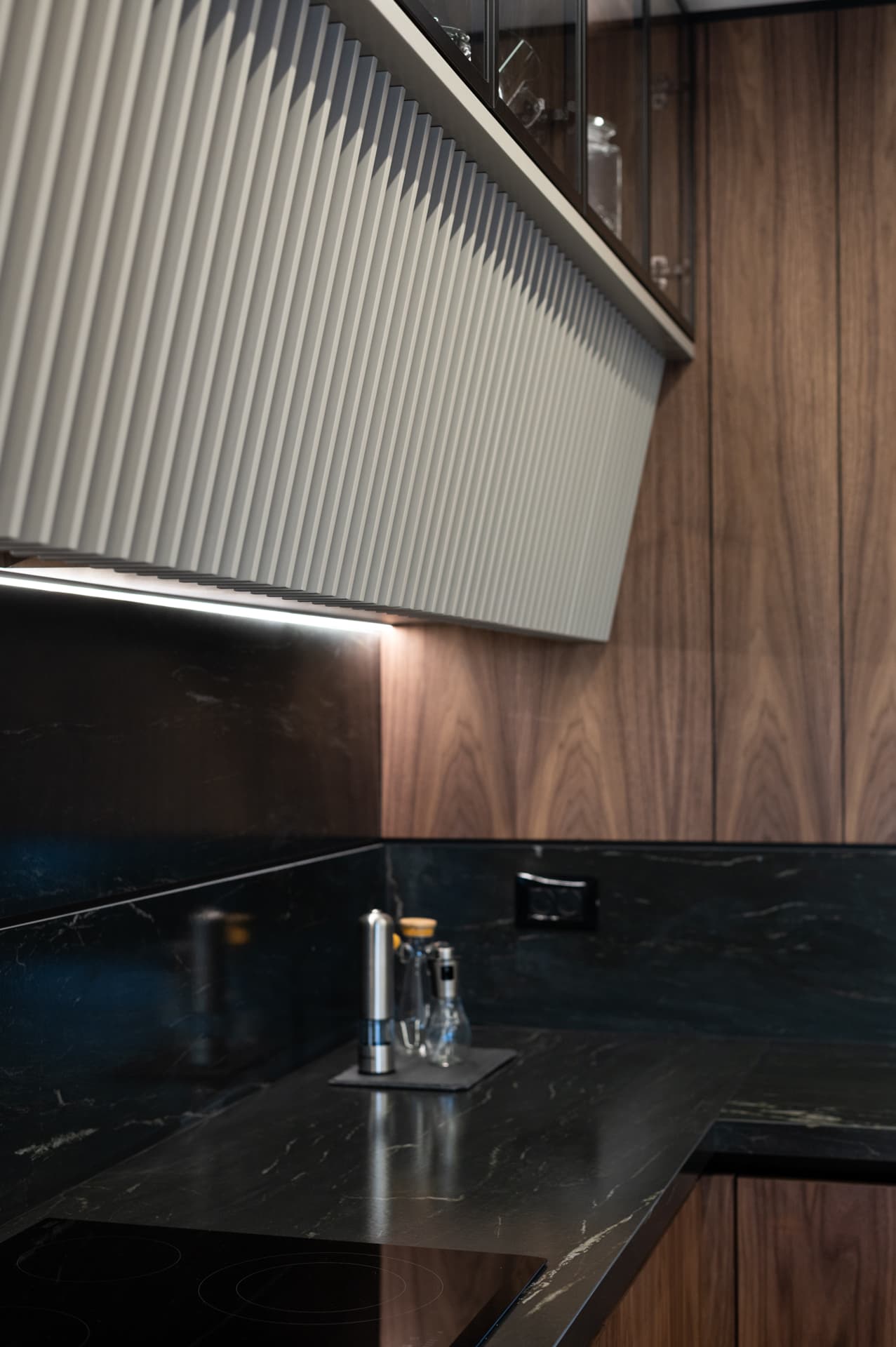 Chevron-stitched black leather bar chair on copper hairpin legs