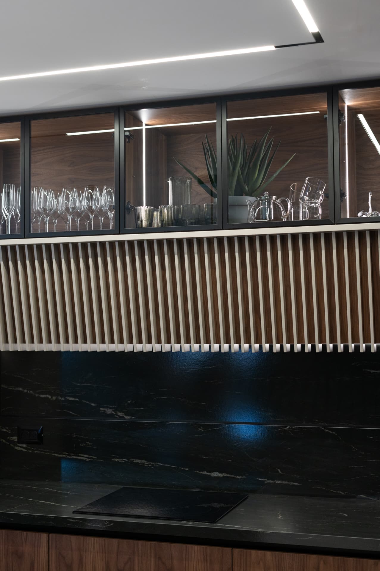 Blue-green marble wall with bronze veining in soaking tub alcove