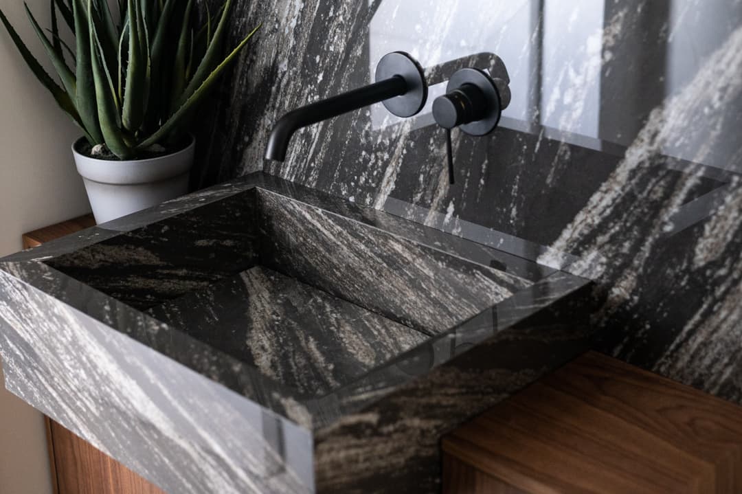 Walnut bed base grain detail with brass pendant light