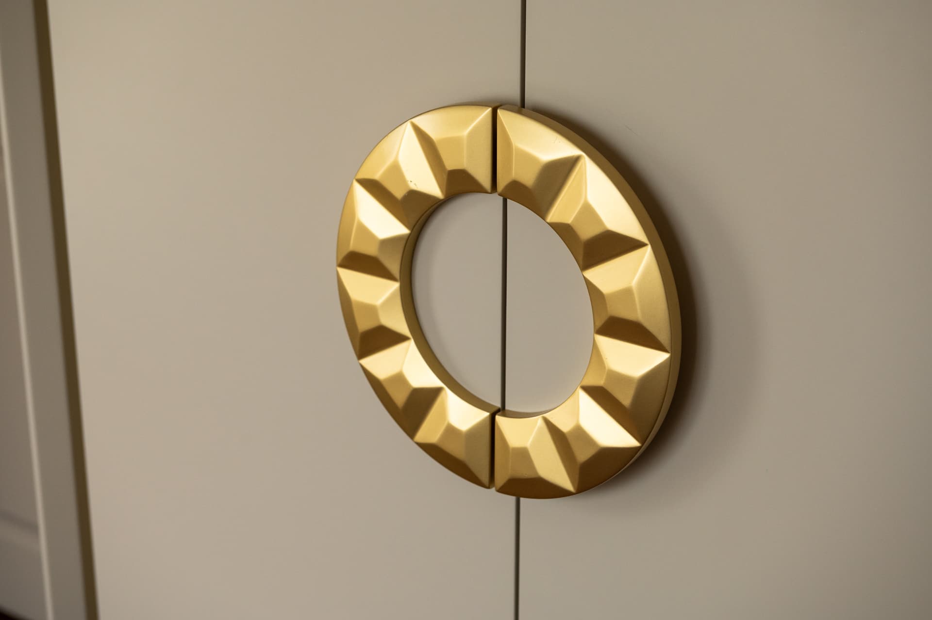 Navy headboard with gold-inlaid rectangular molding and globe pendant