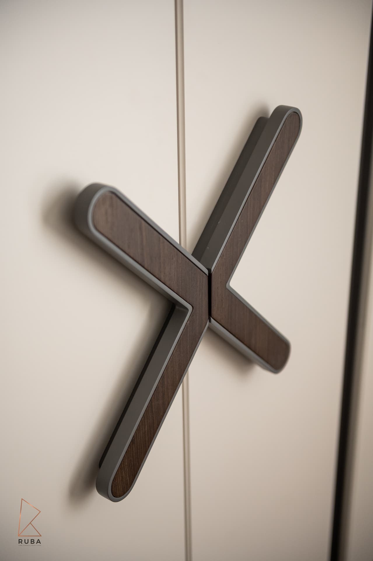 X-shaped dark wood and metal wardrobe handles