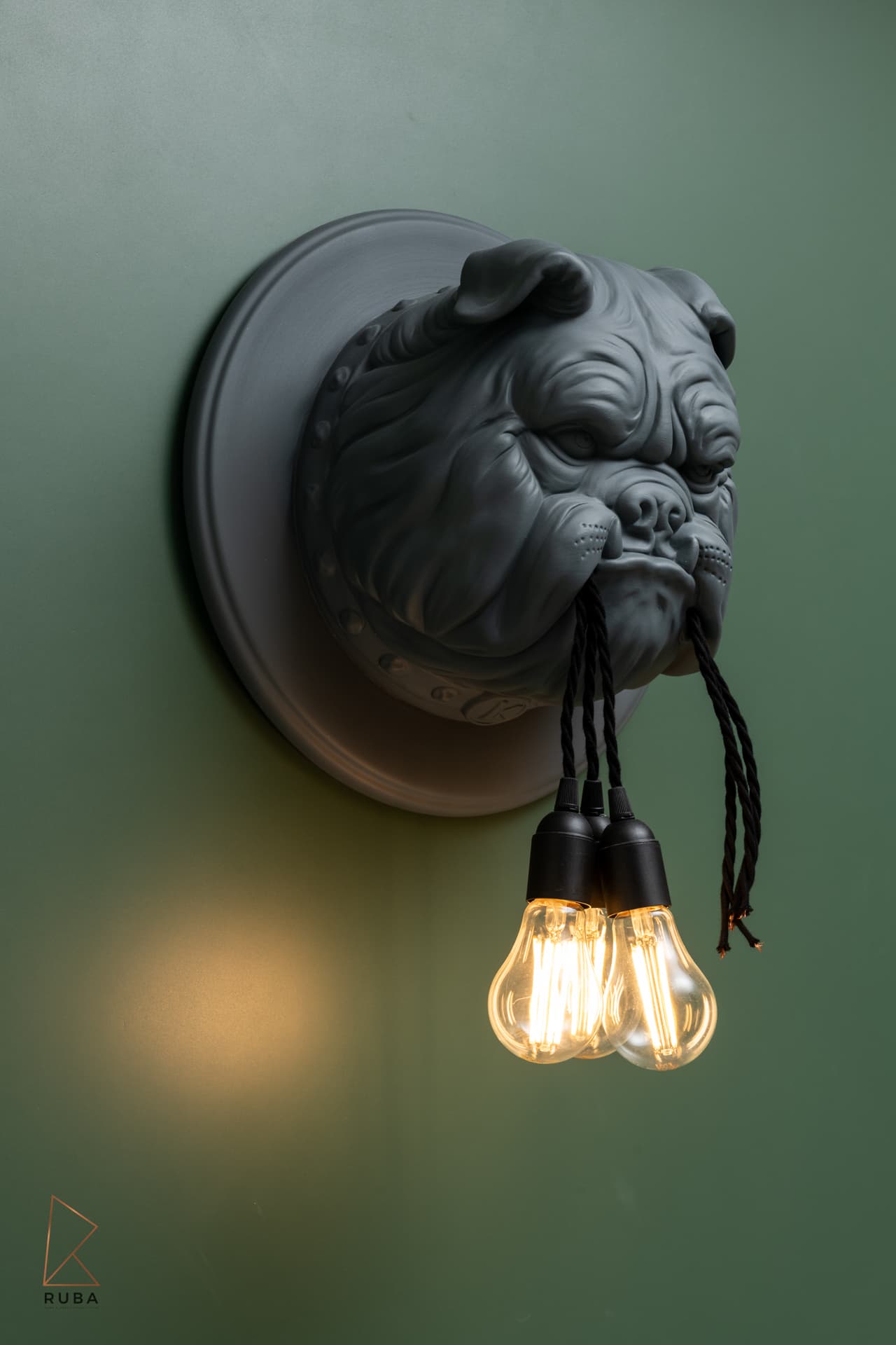 Matte bulldog wall sconce gripping Edison bulbs in its jaw