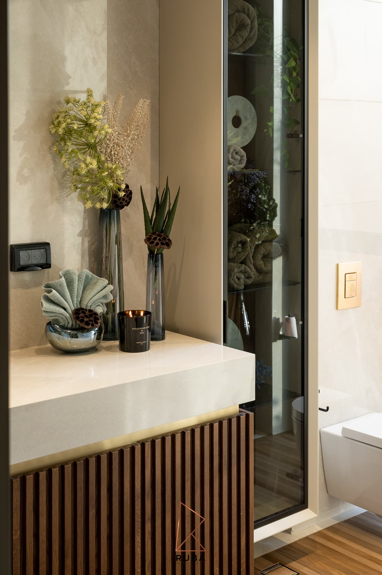 Floating oak stair tread with LED underlight on marble wall