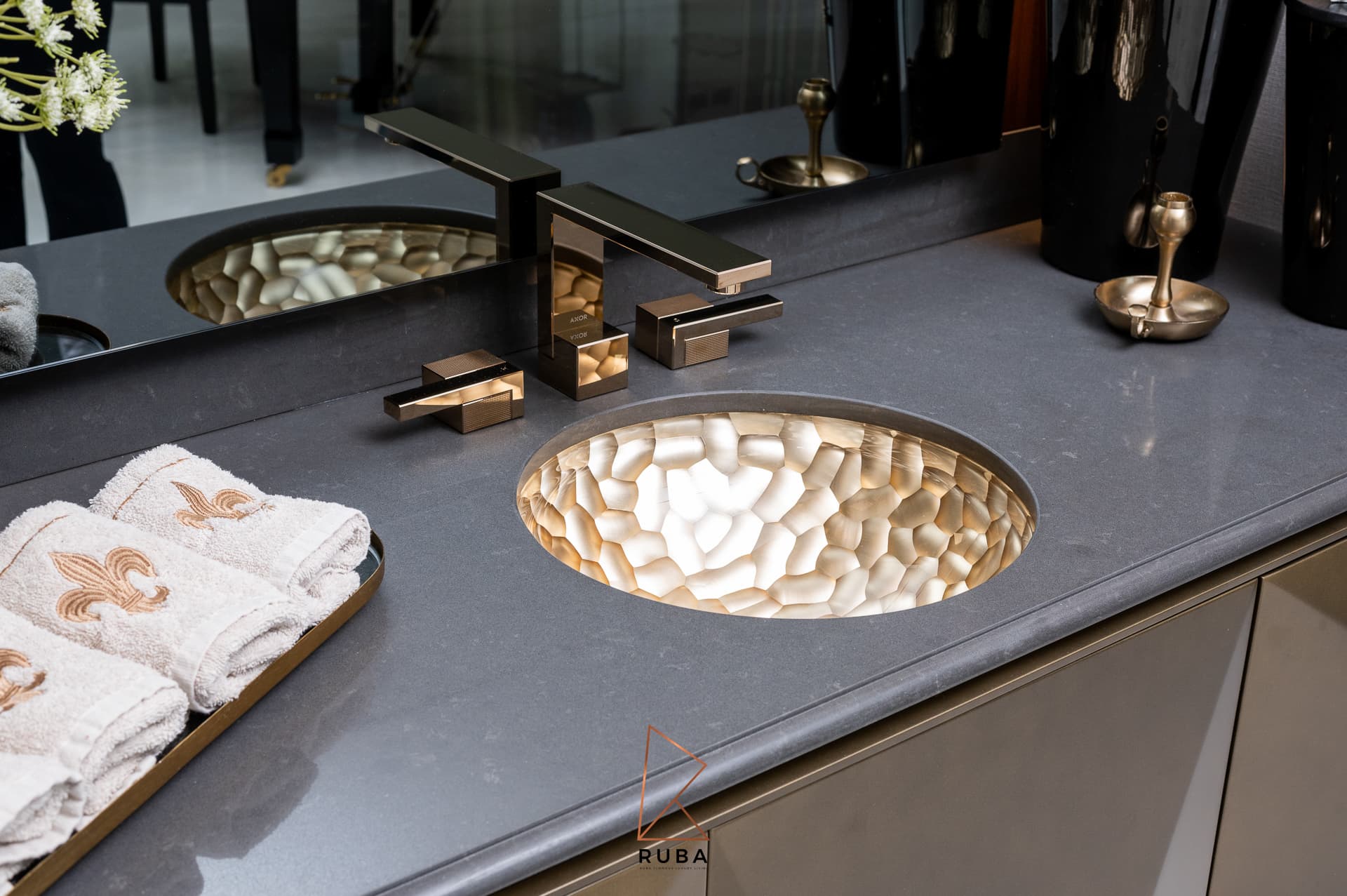 Faceted bronze dining table with geometric folded planes