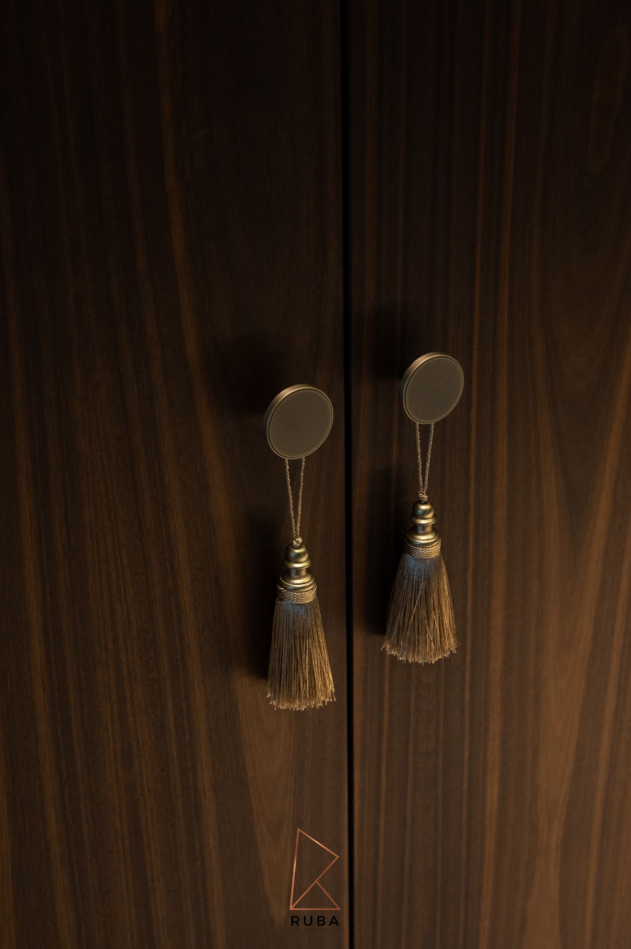 Diamond-cut bronze console with walnut mirror frame