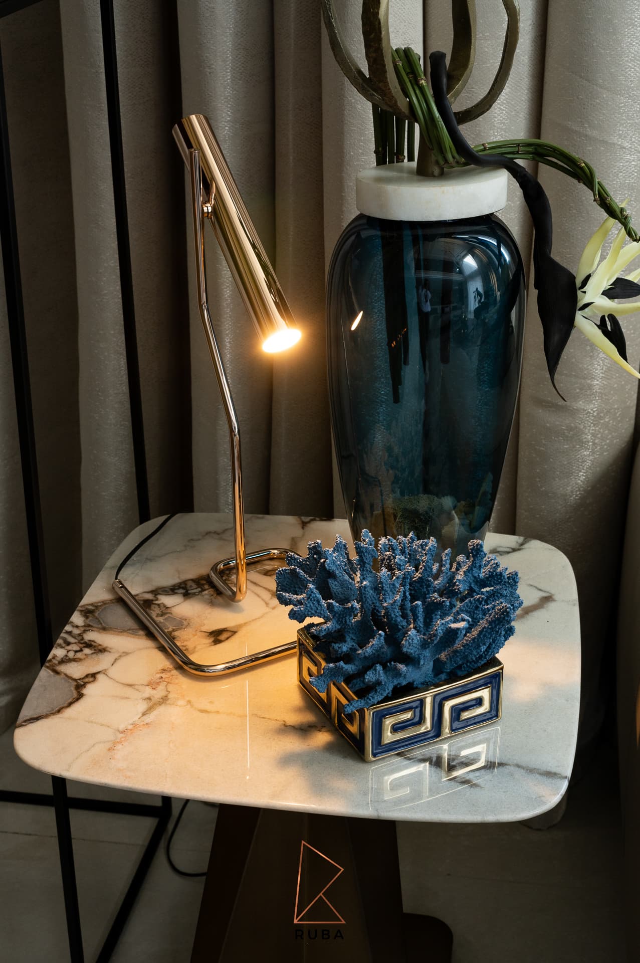 Pearl-bead cascading chandelier against coffered ceiling