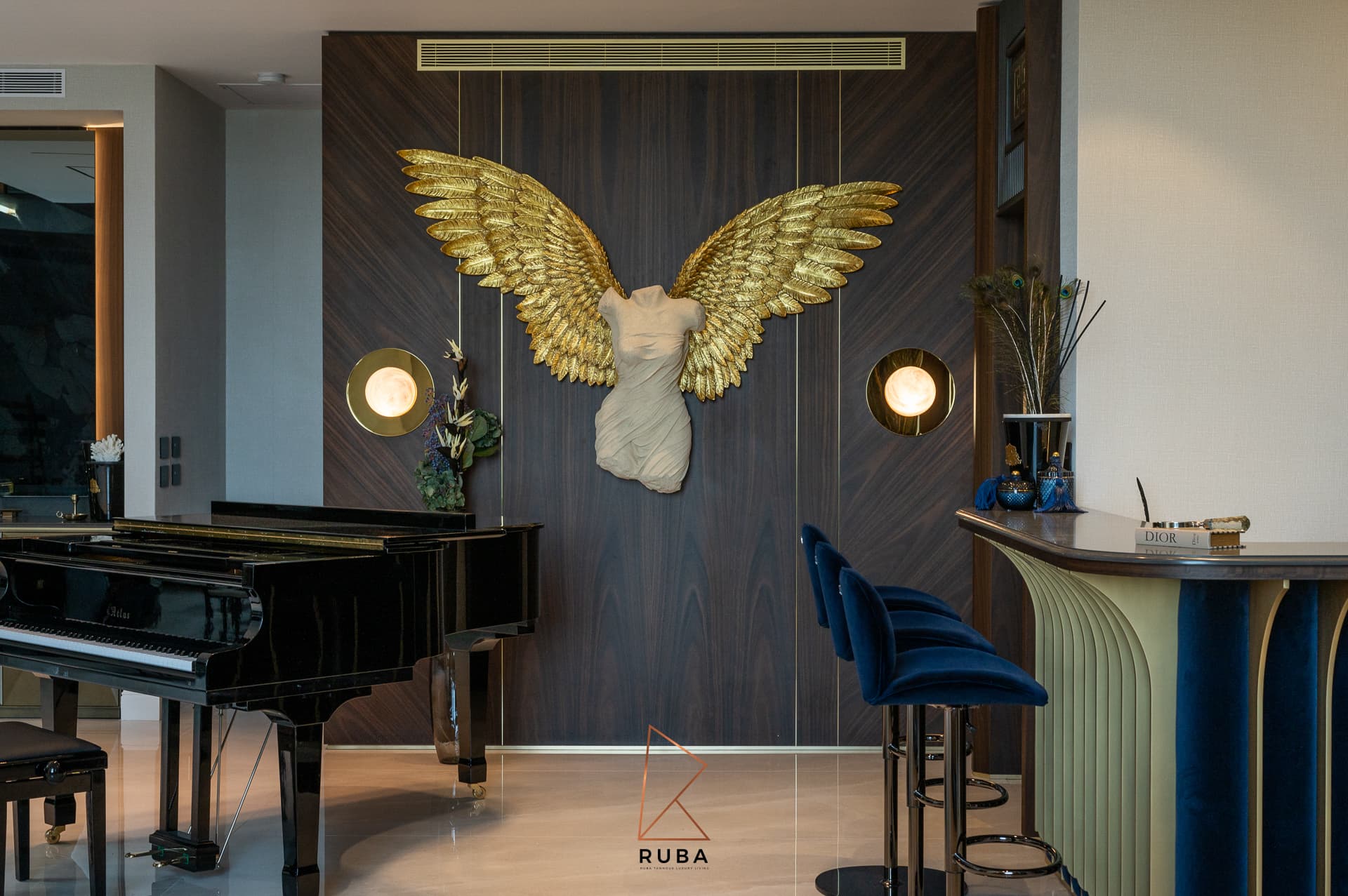 Gold ring pull hardware on charcoal paneled cabinetry