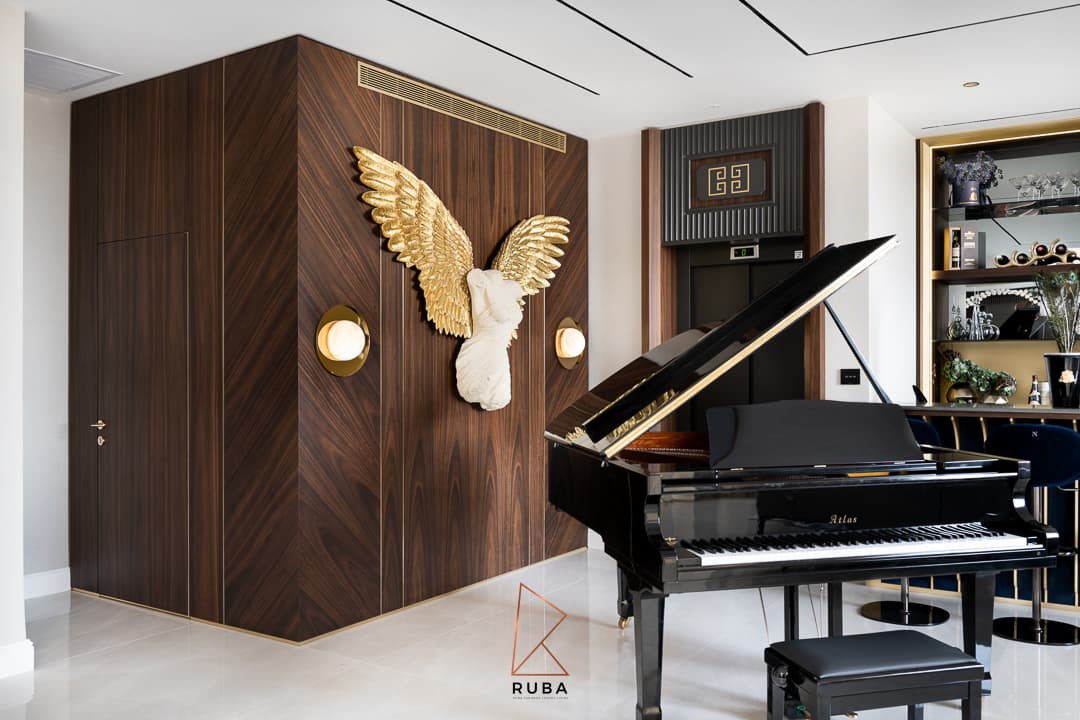 Fluted walnut-slatted vanity with brushed gold faucet