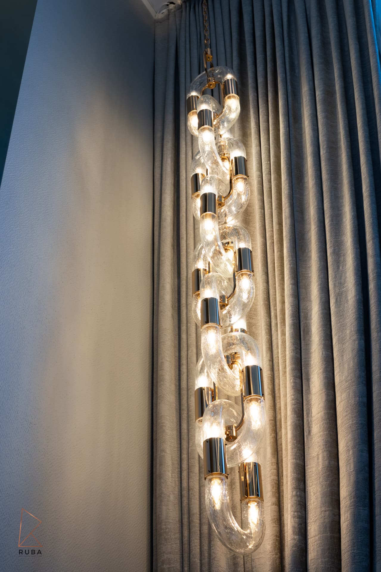 Gold tree-of-life branch sculpture flanking marble fireplace