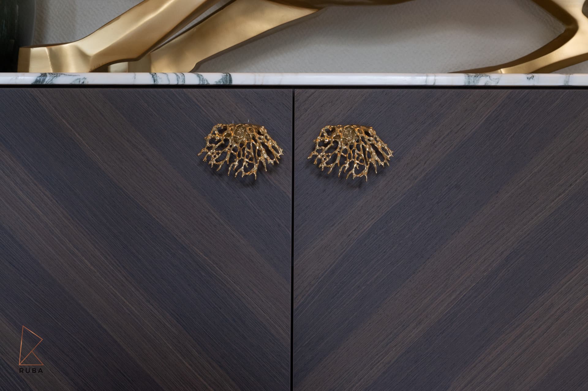Dandelion-burst chandelier cluster in double-height stairwell
