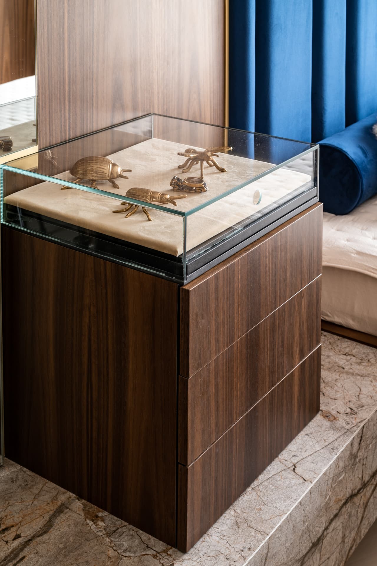 Grey-veined marble with rust-gold threading in bookmatched slabs