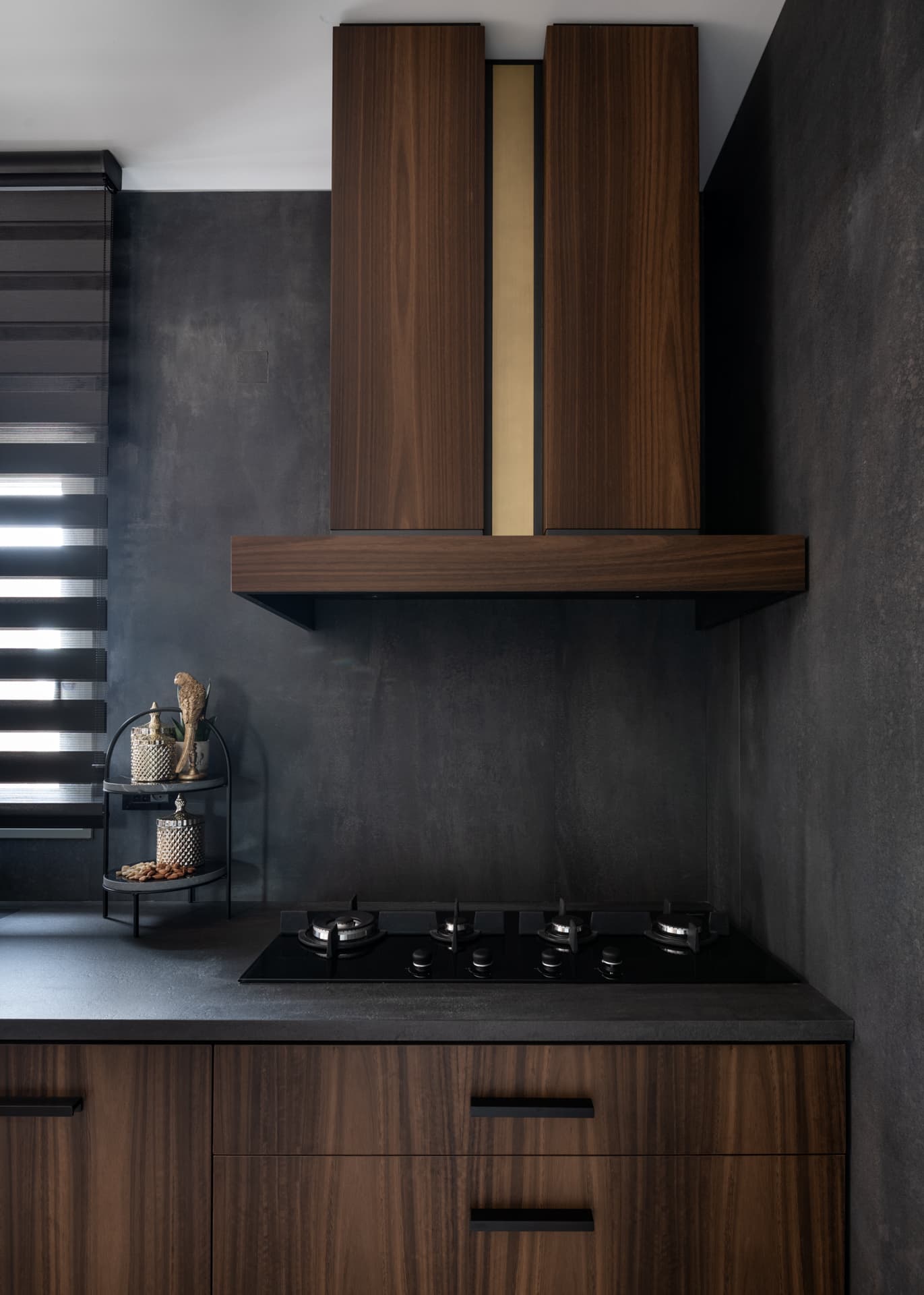 Suspended black metal shelf with trailing pothos herb garden