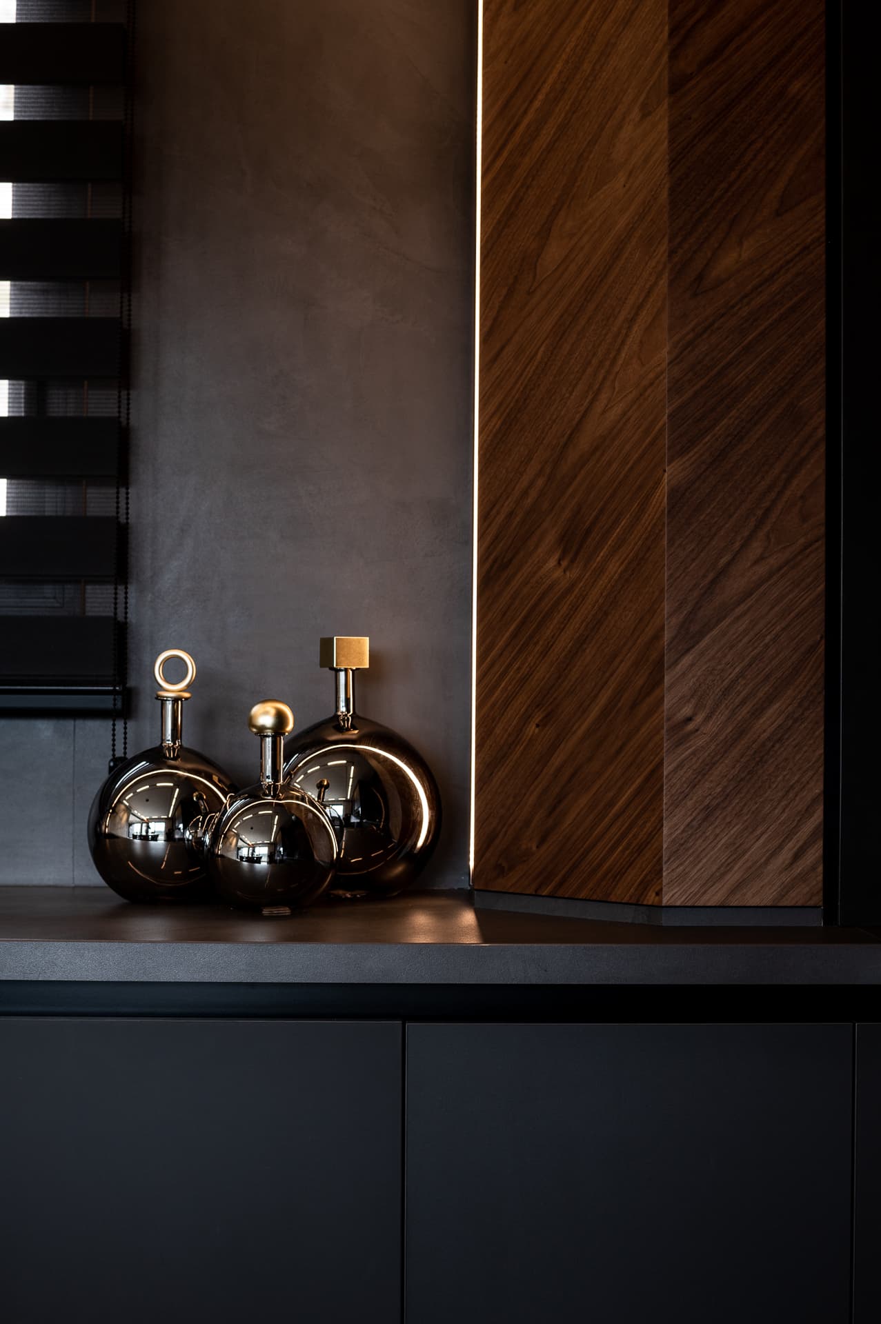 Indoor dark-water pool with tropical plants in sculptural planters