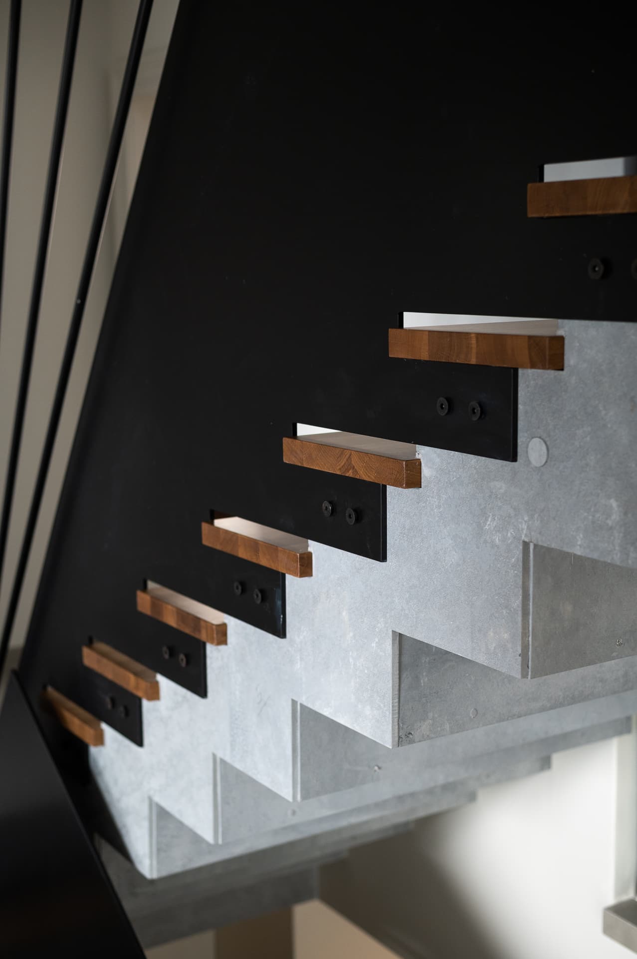 Nested black marble and brass coffee tables with coral sculpture