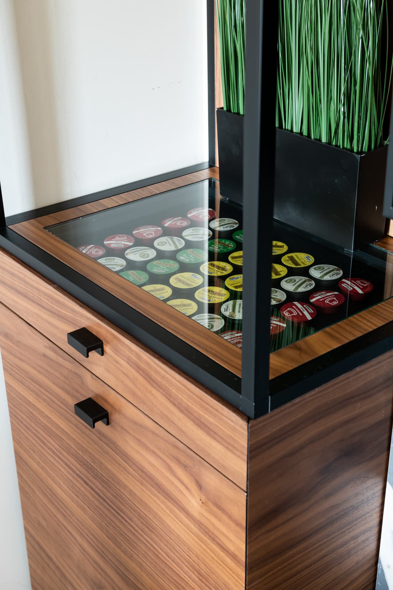 Gold LED cove strip running ceiling perimeter above walnut panels