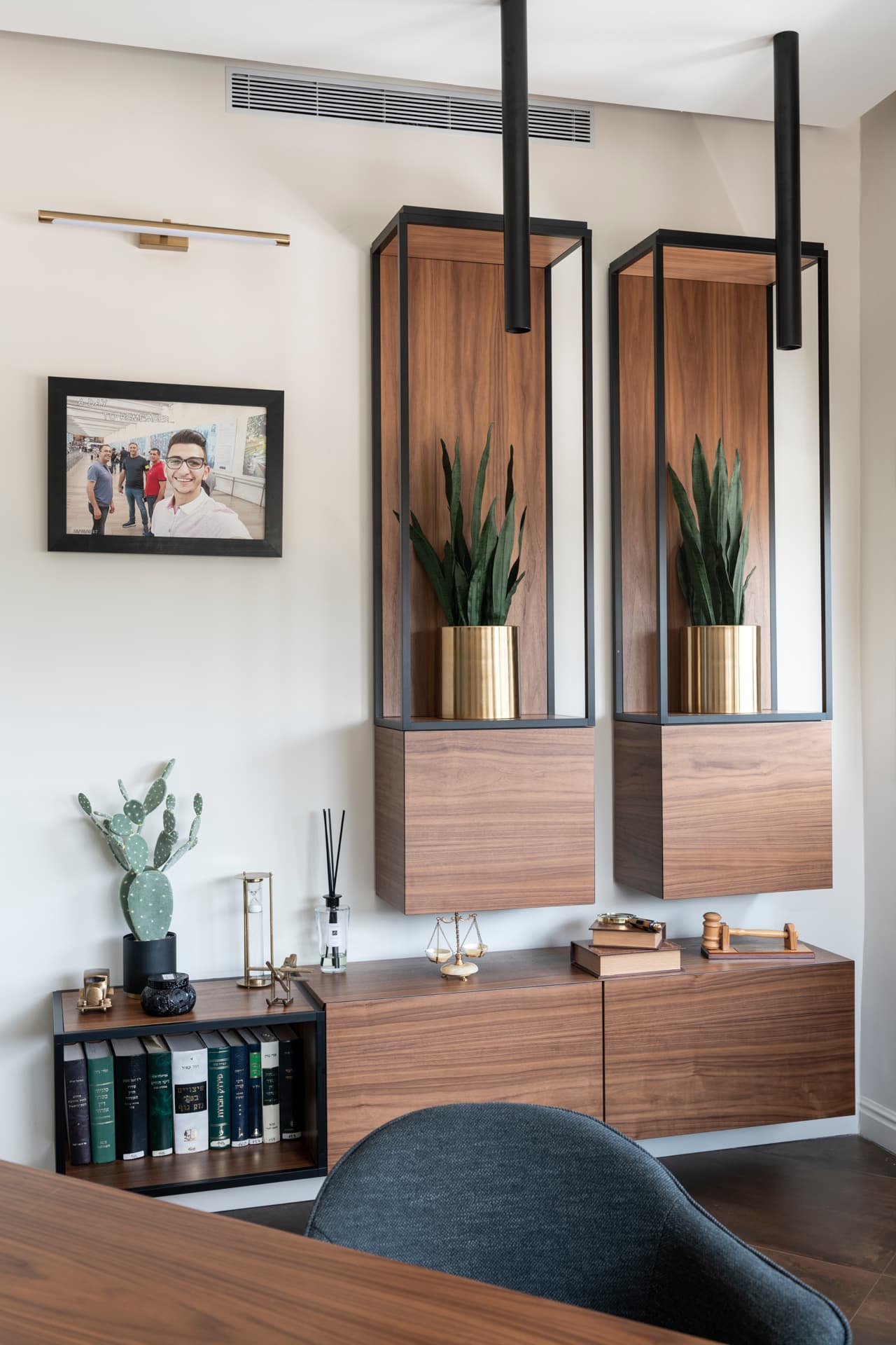 Dark walnut corridor paneling with glass-framed door intervals