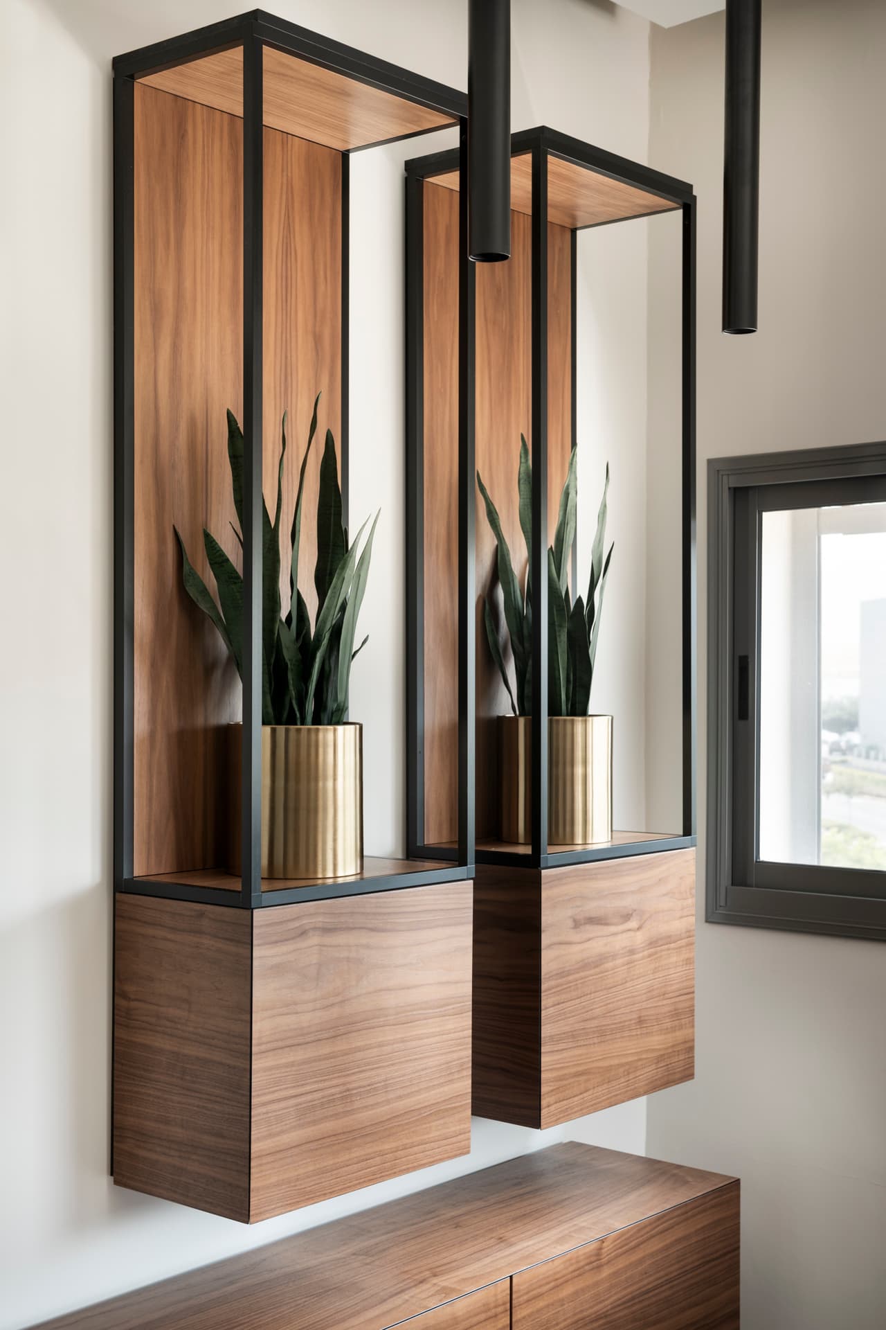 Dark-stained concrete floor with walnut desk partition