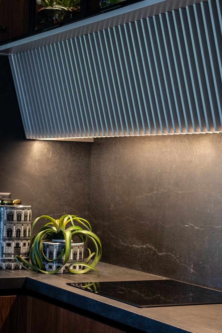 Mauve velvet arch headboard with embroidered laurel crest