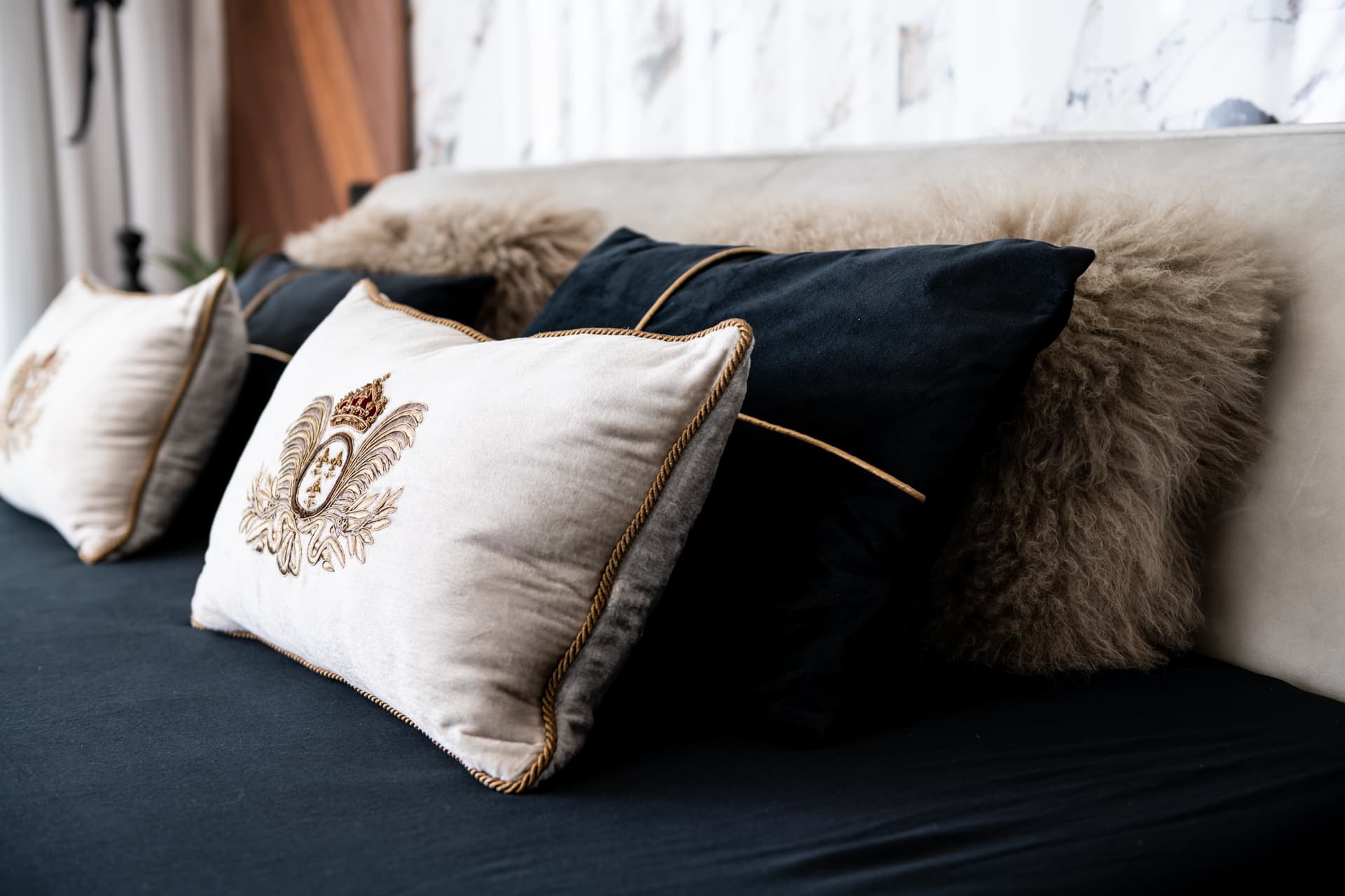 Gold vertical strip bisecting walnut kitchen cabinetry