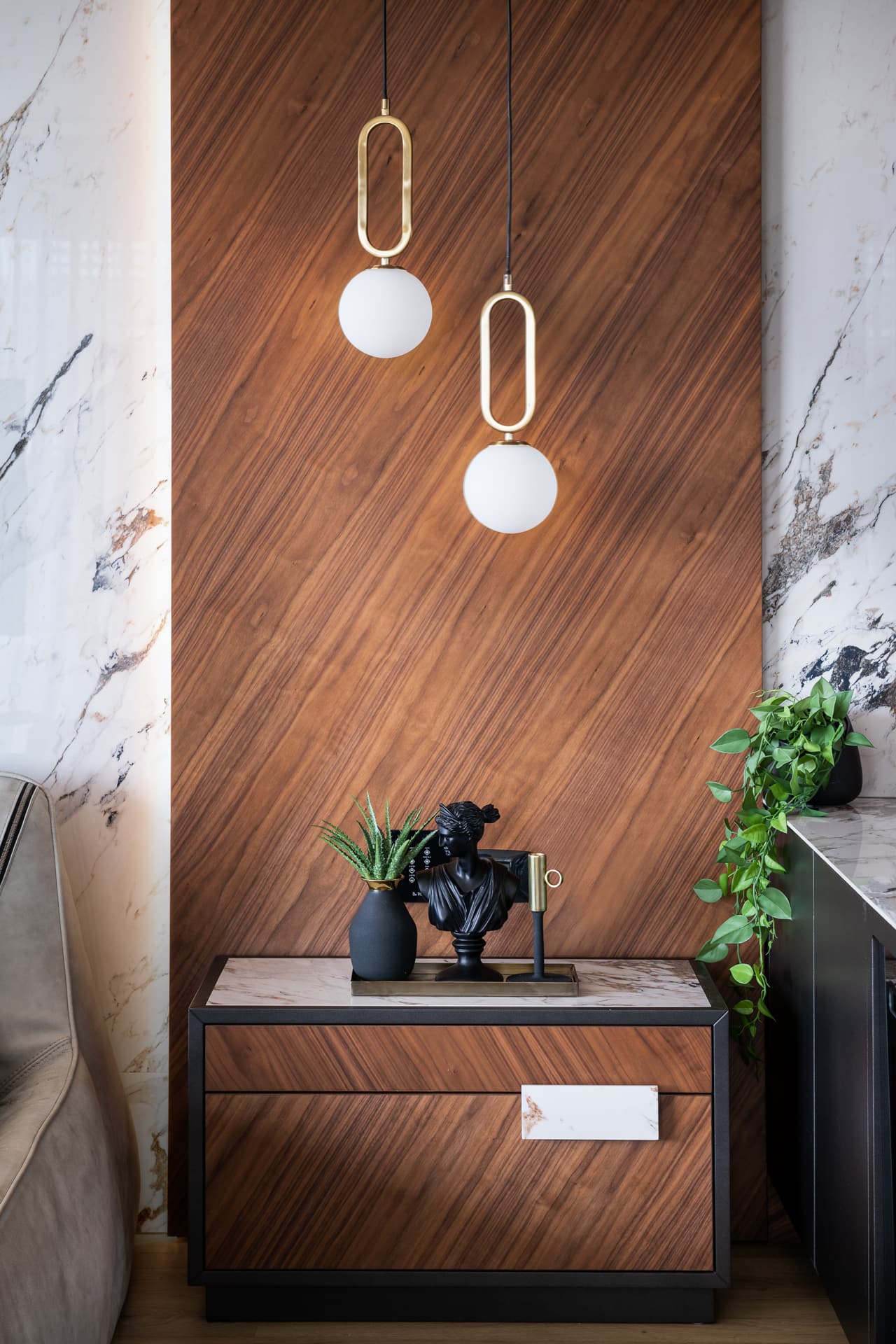 Black steel-and-glass coffee table with succulent arrangement