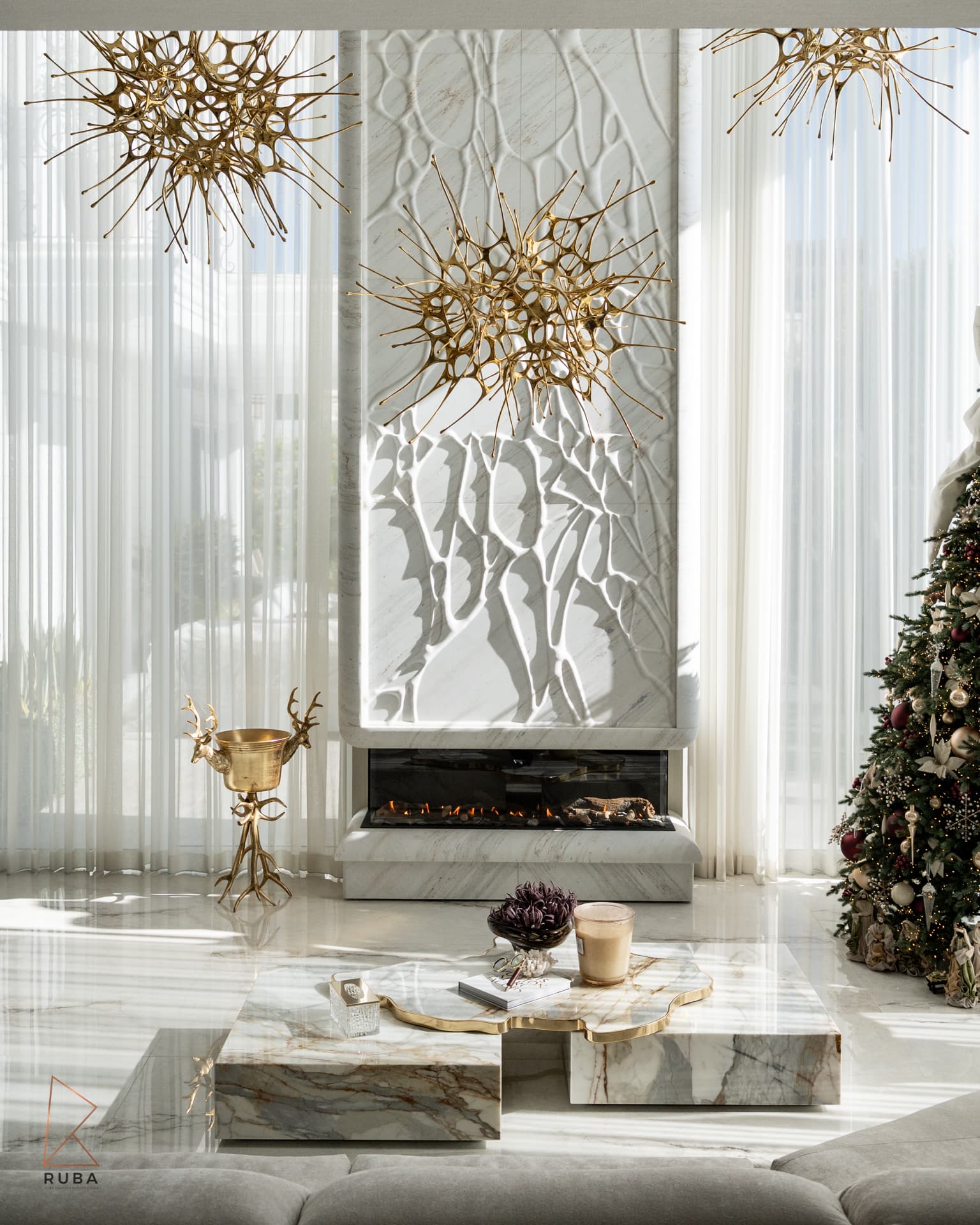 A carved plaster relief over a sculpted fireplace — atelier signature